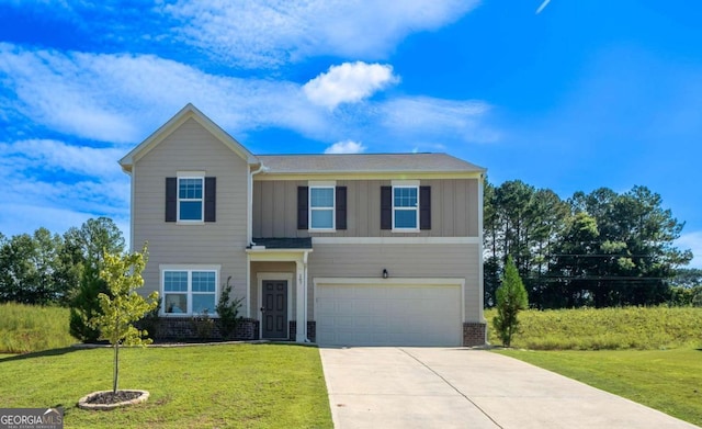 view of front of house featuring a garage and a front lawn