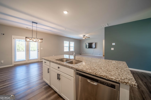 kitchen featuring dishwasher, a center island with sink, sink, ceiling fan, and white cabinetry