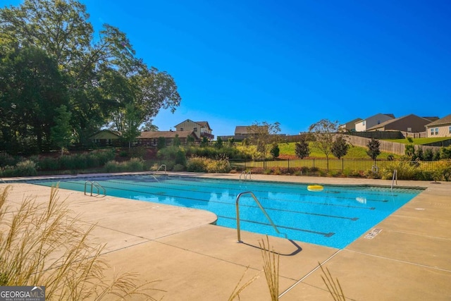 view of swimming pool with a patio area