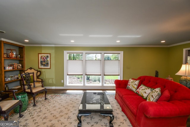 living room with ornamental molding and hardwood / wood-style floors