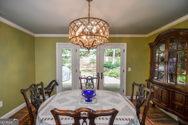 dining room with a notable chandelier, plenty of natural light, and dark hardwood / wood-style flooring