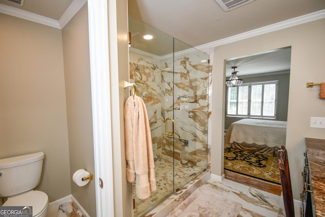 bathroom with a shower with shower door, toilet, and crown molding