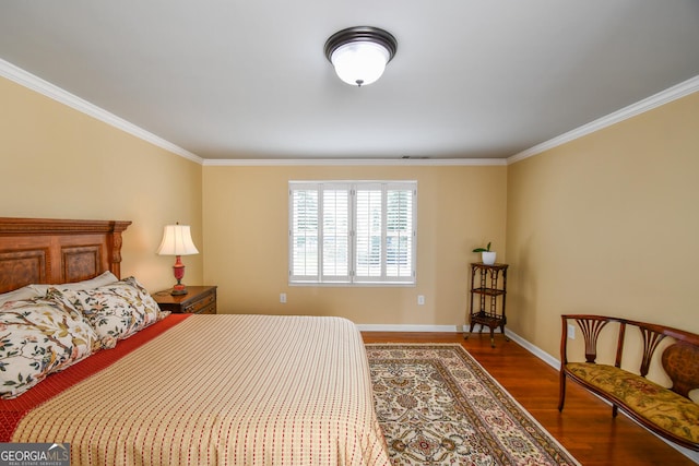 bedroom with hardwood / wood-style flooring and crown molding