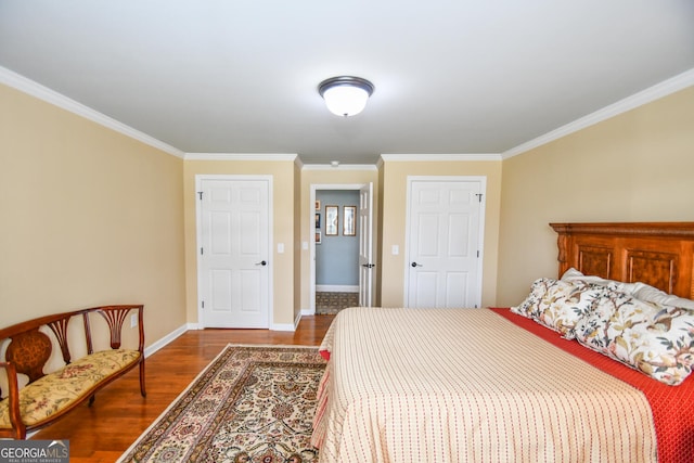 bedroom featuring wood-type flooring and crown molding