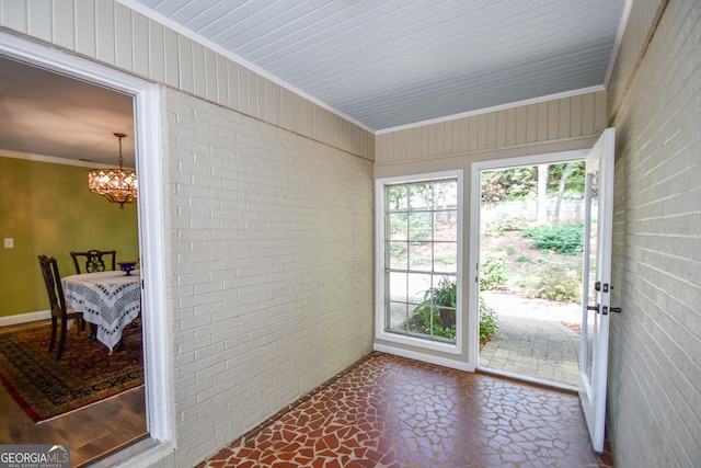 sunroom with an inviting chandelier