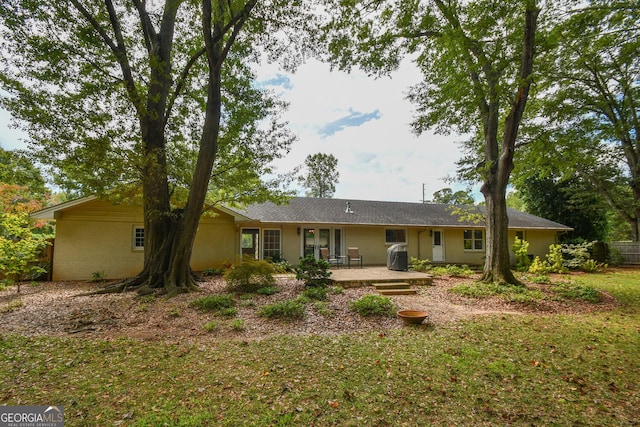 back of property featuring a patio area