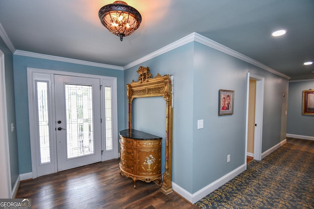 foyer entrance featuring ornamental molding and dark hardwood / wood-style flooring