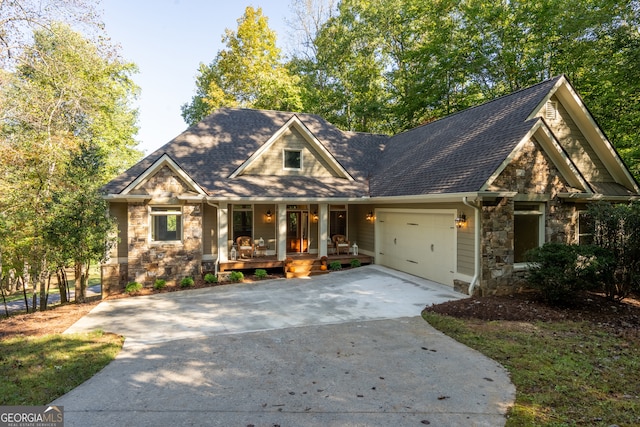 craftsman inspired home with a garage and a porch