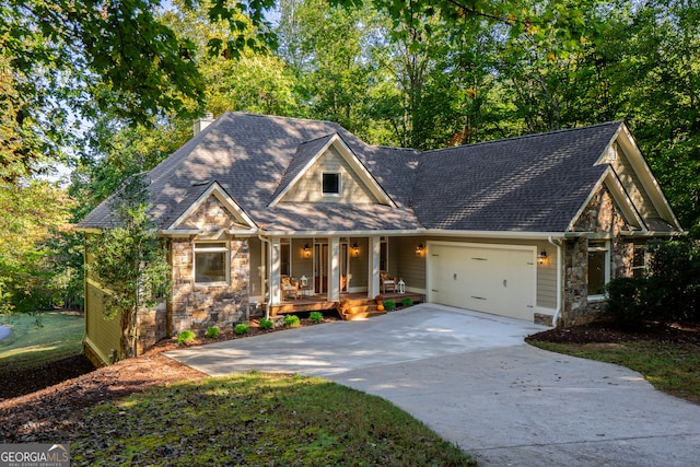 craftsman-style house with a garage and covered porch