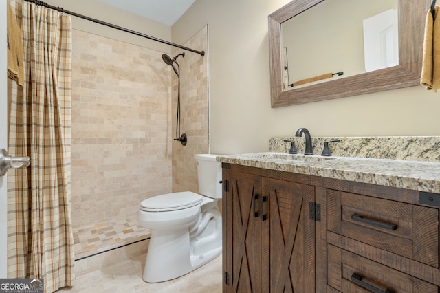 bathroom with tile patterned floors, vanity, and toilet