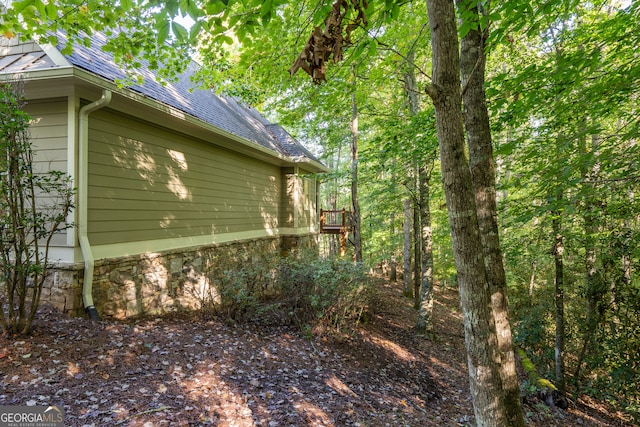 view of home's exterior featuring a wooden deck