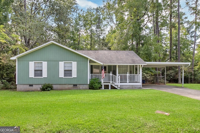 view of front of home with a carport, a porch, and a front lawn