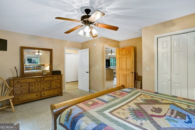 bedroom featuring ceiling fan and light colored carpet