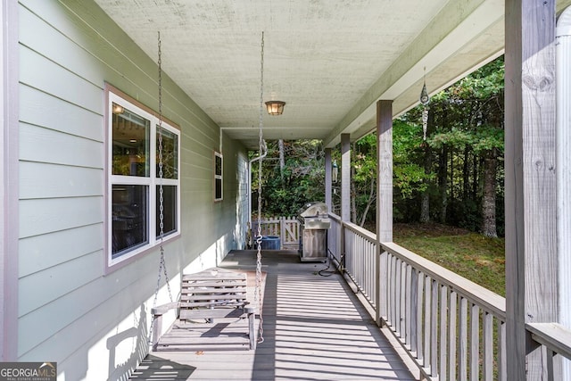 wooden terrace featuring grilling area