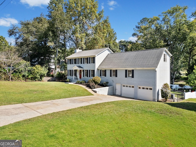 view of front of home featuring a garage and a front yard