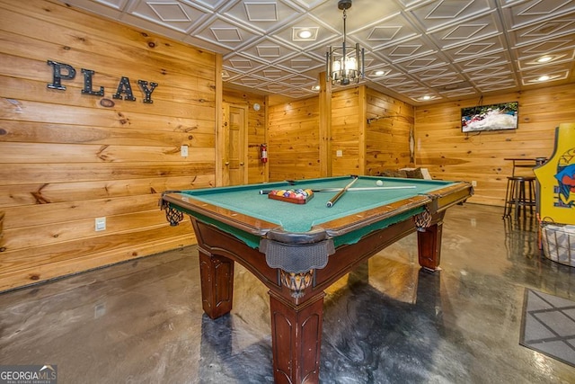 game room with pool table and wooden walls