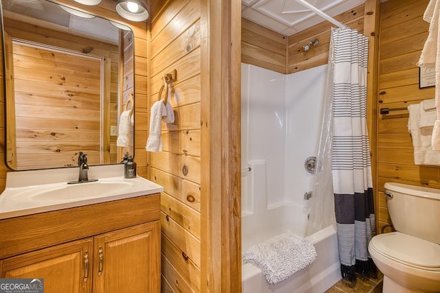 full bathroom with wood walls, shower / bathtub combination with curtain, and vanity