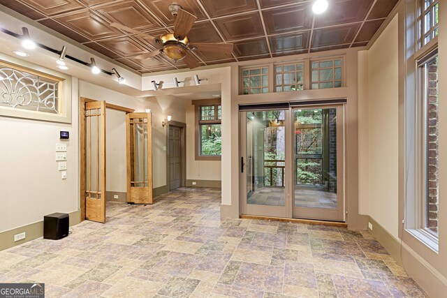 interior space featuring ceiling fan