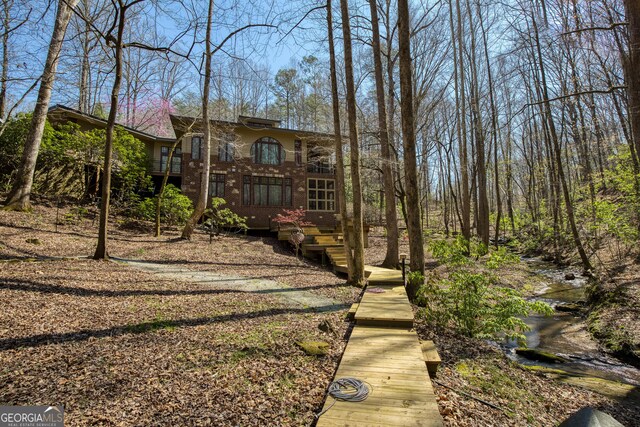 view of yard featuring a wooden deck