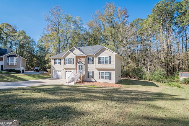 split foyer home featuring a garage and a front yard