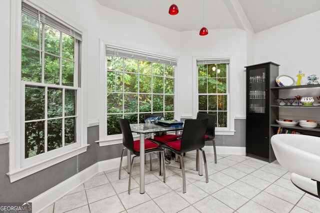 kitchen featuring double oven, plenty of natural light, a center island, and white cabinets