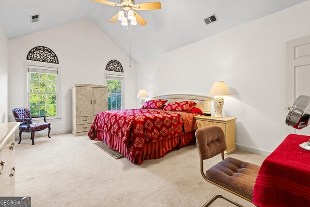 carpeted bedroom featuring ceiling fan and vaulted ceiling