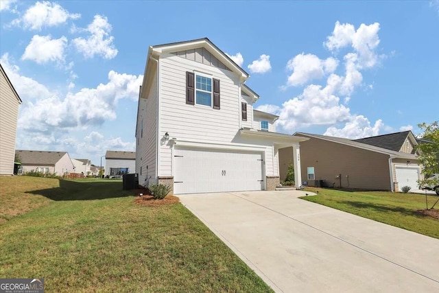 view of front of home featuring a front yard and a garage