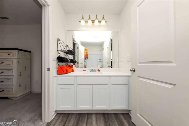 bathroom featuring vanity and hardwood / wood-style flooring