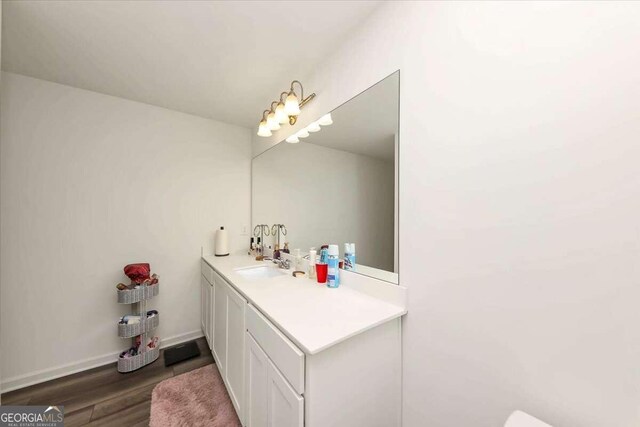 bathroom with vanity and hardwood / wood-style flooring