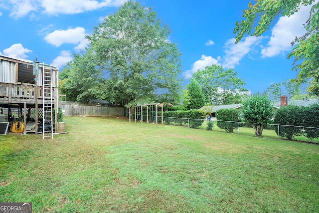 view of yard featuring a wooden deck