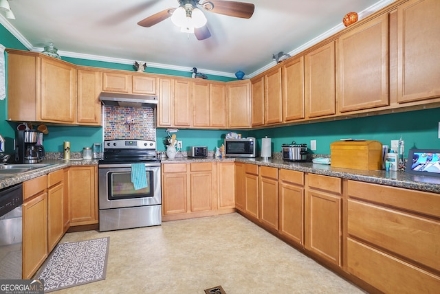 kitchen featuring stainless steel appliances, ceiling fan, dark stone counters, ornamental molding, and sink