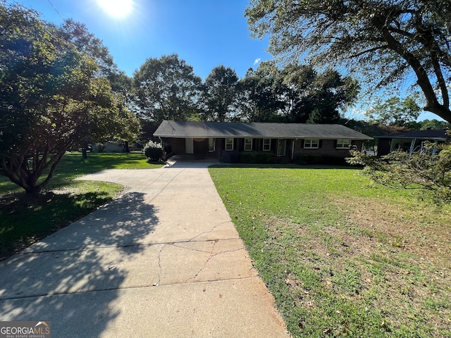 ranch-style house with a front yard