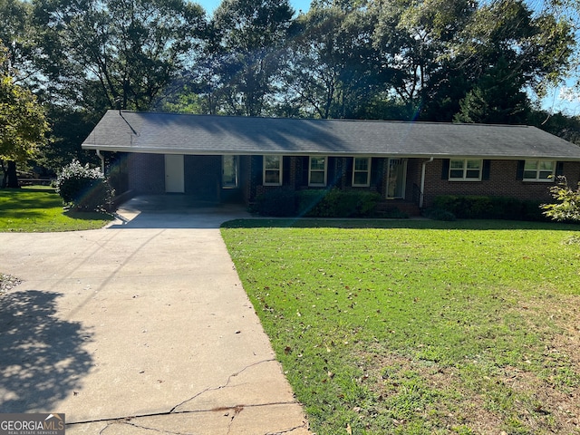 single story home with a front lawn and a carport