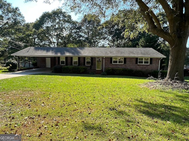 ranch-style home with a front yard and a carport