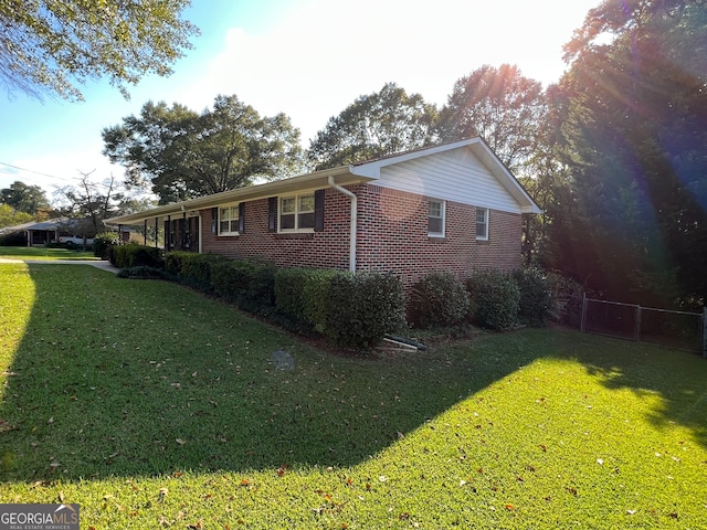 view of property exterior featuring a yard