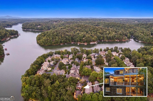 birds eye view of property featuring a water view