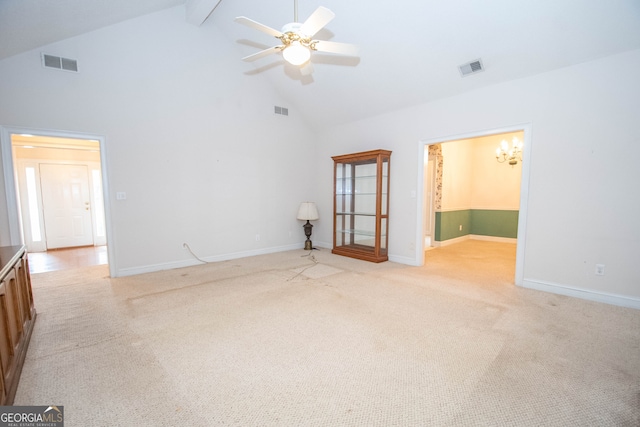 spare room featuring high vaulted ceiling, ceiling fan, beamed ceiling, and light carpet