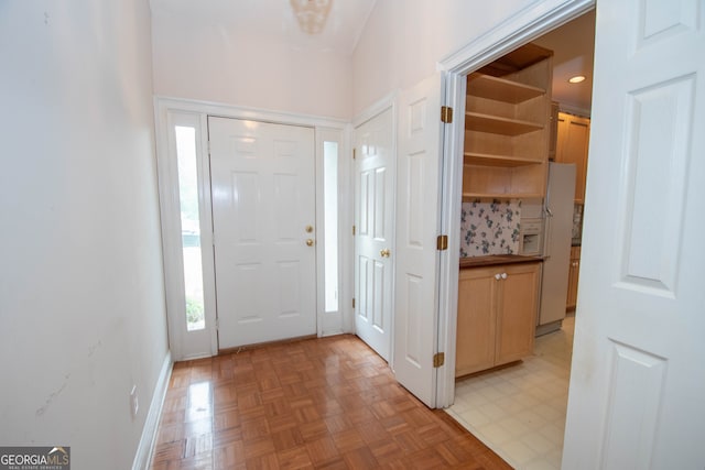 entrance foyer featuring light parquet floors