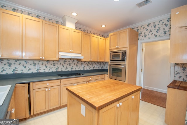 kitchen with light brown cabinetry, appliances with stainless steel finishes, and crown molding