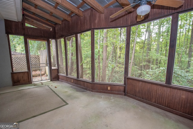 unfurnished sunroom with lofted ceiling, ceiling fan, and a wealth of natural light