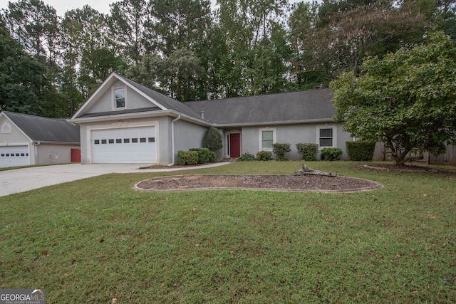 ranch-style house featuring a garage and a front lawn