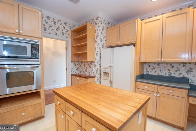 kitchen with crown molding, a center island, light brown cabinetry, and stainless steel appliances