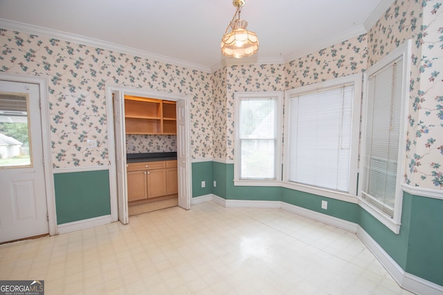 interior space featuring ornamental molding and a wealth of natural light