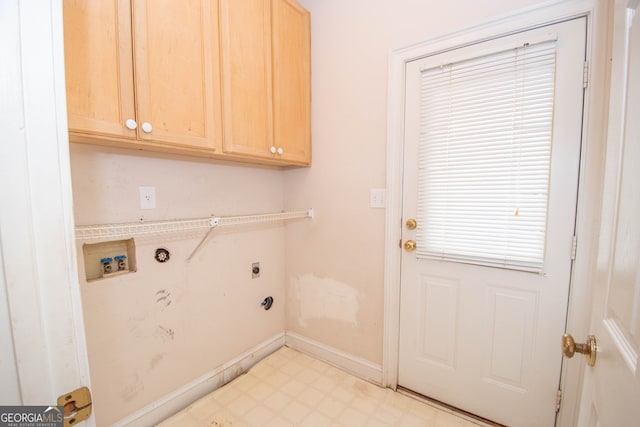 laundry room with hookup for a washing machine, cabinets, and electric dryer hookup