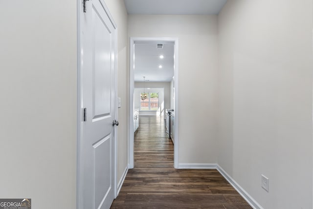 corridor featuring dark hardwood / wood-style floors