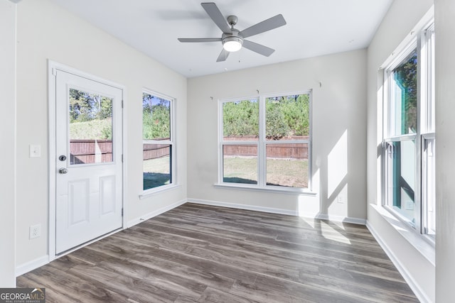 interior space featuring ceiling fan and dark hardwood / wood-style flooring