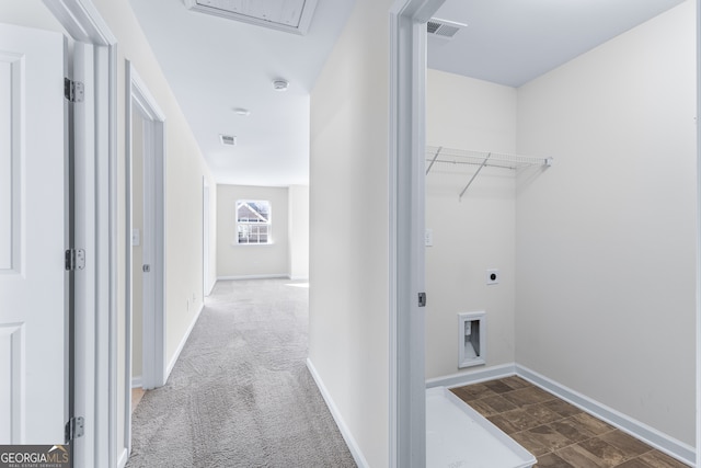 laundry room with hookup for an electric dryer and dark carpet