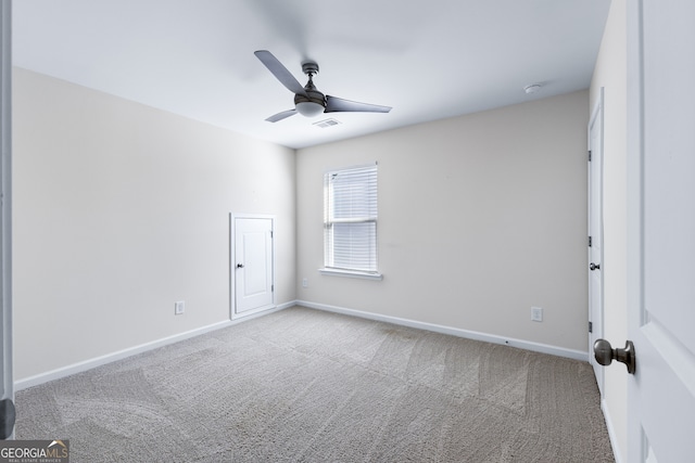 empty room with carpet and ceiling fan