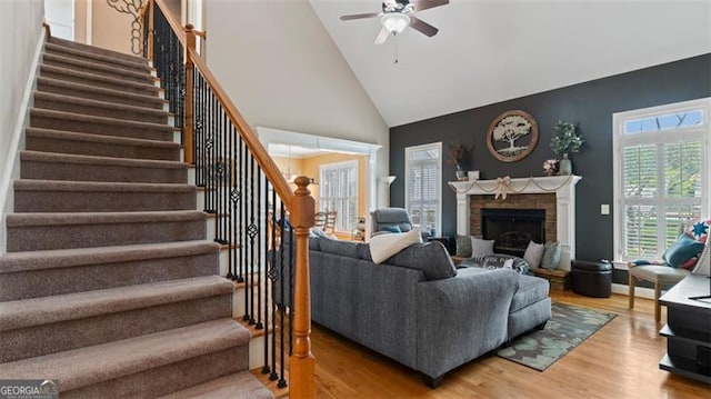 living room with high vaulted ceiling, ceiling fan, and hardwood / wood-style floors