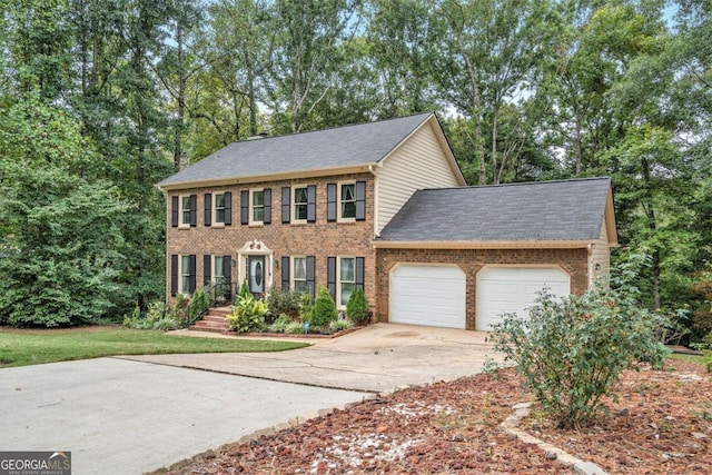 colonial inspired home with a garage